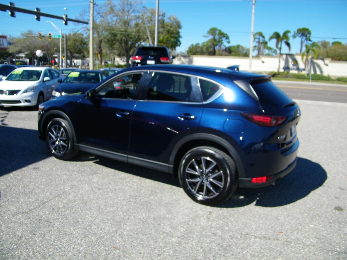 2018 Blue /Black Mazda CX-5 Grand Touring (JM3KFADM8J1) with an 2.5L L4 DOHC 16V engine, 6A transmission, located at 4000 Bee Ridge Road, Sarasota, FL, 34233, (941) 926-0300, 27.298664, -82.489151 - Photo#3